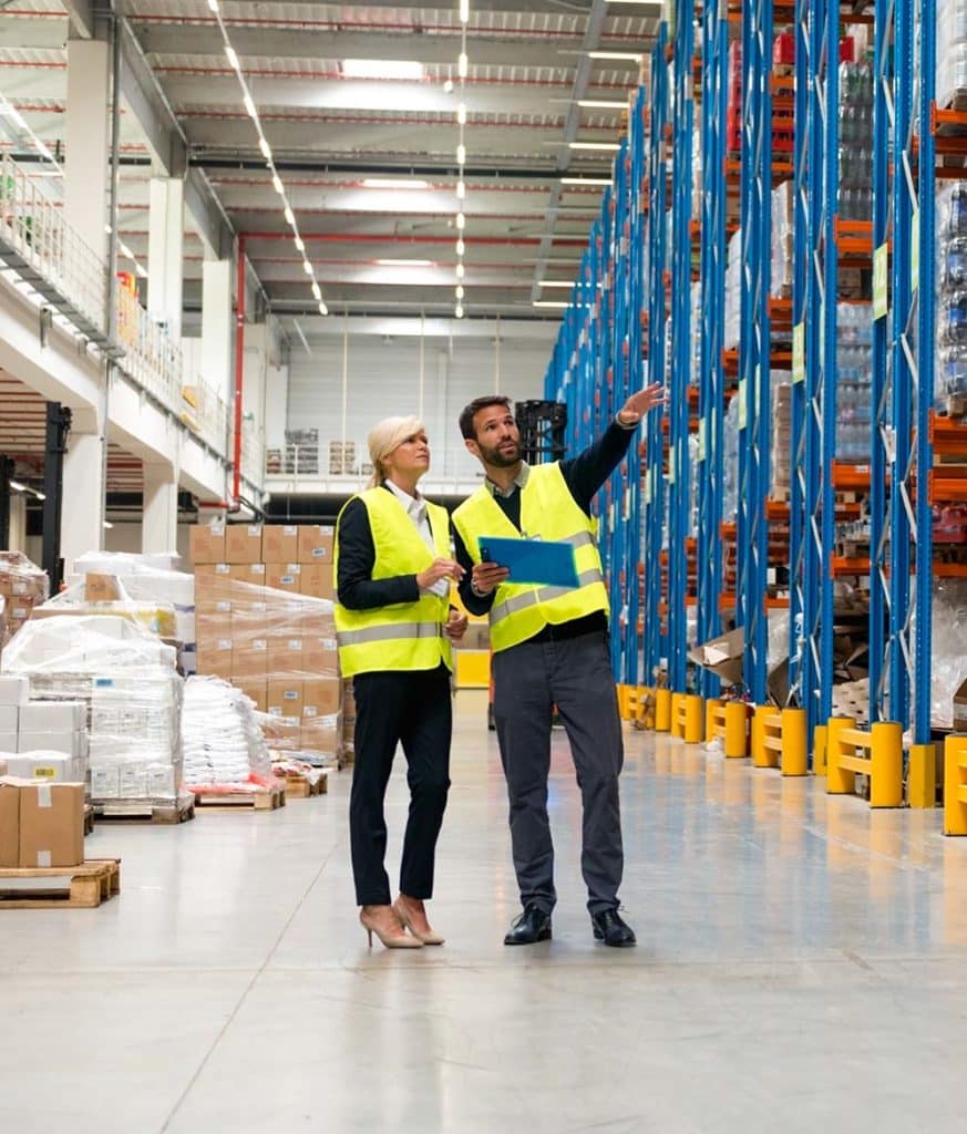 Managers walking thru warehouse